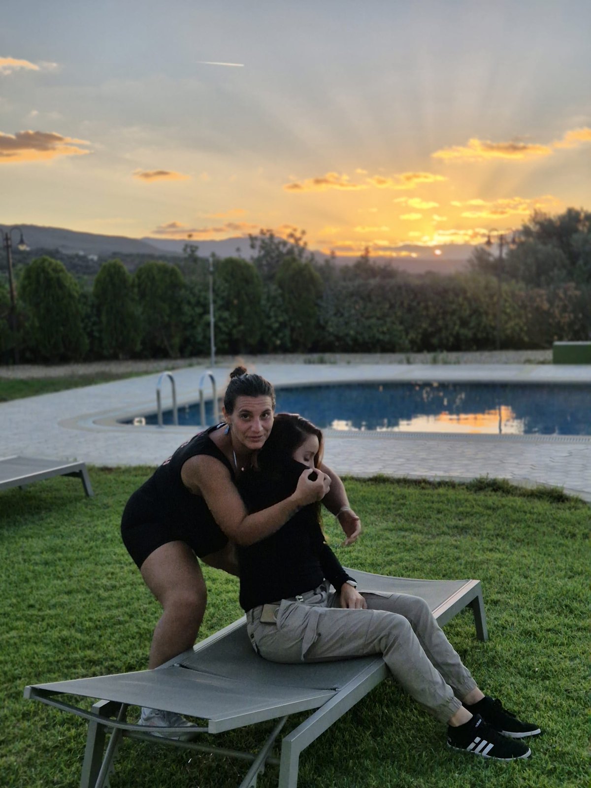 Ludo goofing around by the pool at sunset