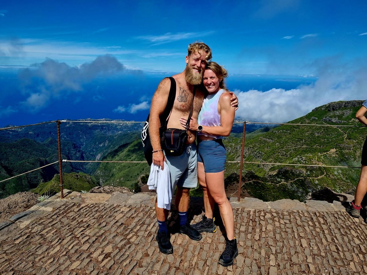Two athletes taking in the coastal view