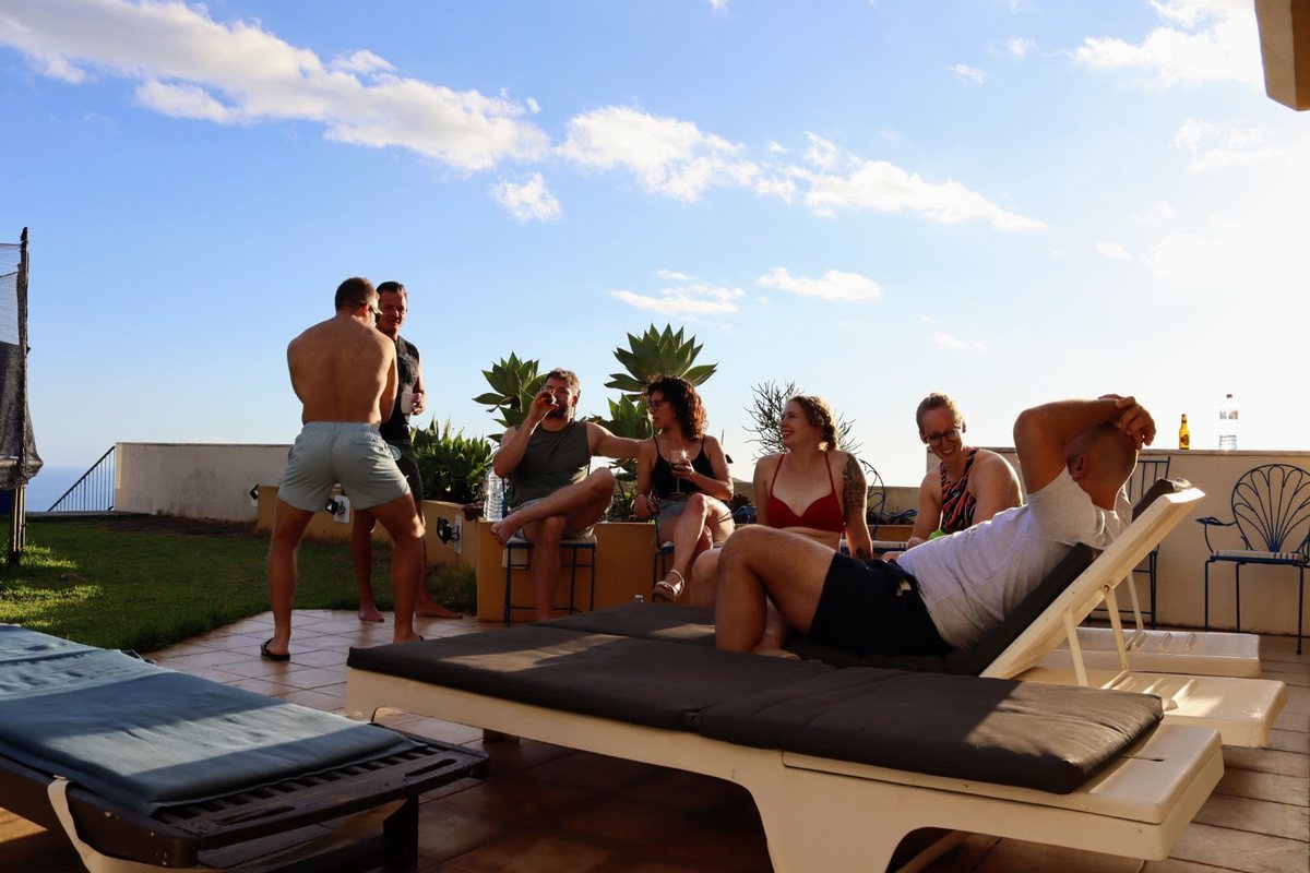 Group unwinding on the terrace at golden hour