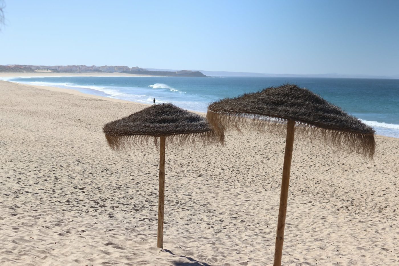Beach umbrellas on an empty beach